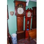 An Oak and other woods Longcase Clock having an eight day movement striking on a bell and with an