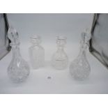 A pair of matching cut glass decanters and two Stuart cut glass decanters.