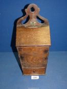 An Oak Candle Box with hinged lid and lower drawer having shaped back plate,