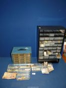 A quantity of miscellaneous foreign coins in a metal drawer unit including USA, Yugoslavia,