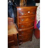 A contemporary tall bow fronted Mahogany and Walnut Chest of six short Drawers in the style of a