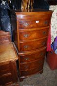 A contemporary tall bow fronted Mahogany and Walnut Chest of six short Drawers in the style of a