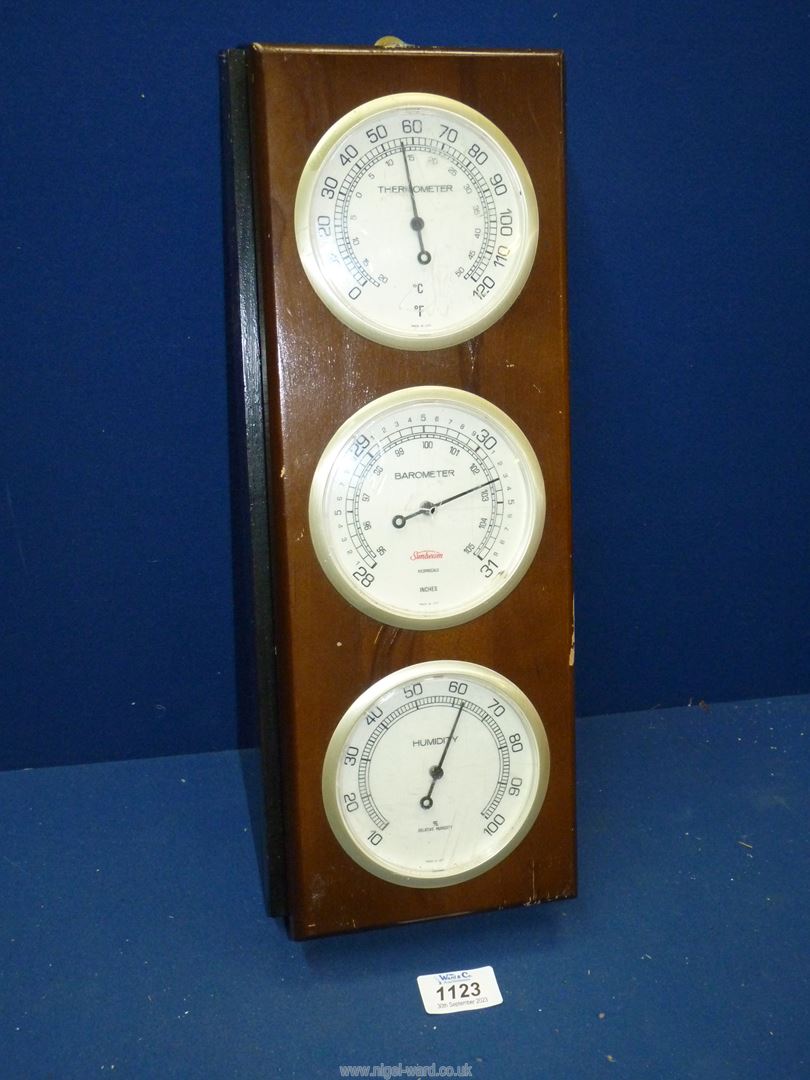 A Sunbeam barometer with thermometer and humidity gauge, central dial cracked, 16'' high x 6'' wide.