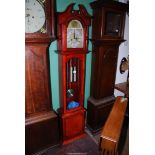 A contemporary Longcase Clock having an arched face with Roman numerals,