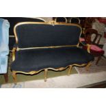 A gilded framed French style six legged three seater Sofa unusually upholstered in black fabric. N.