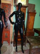 A black gloss full body shop mannequin with removable head, 70" tall. N.B.