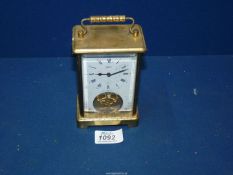 A Schatz brass Carriage clock with white face, 5 1/4'' high x 3 1/4'' wide x 2'' deep.