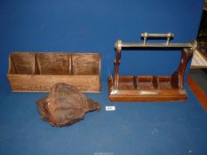 A wood and plated metal Tantalus (no decanters present),