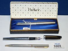 A 1960's Parker fountain pen, stainless steel, in box with original spares,