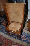 A most charming and collectable Oak and other woods Orkney type Lambing Chair having a woven