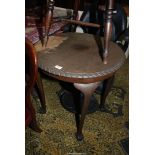 A circular Mahogany Table standing on cabriole legs terminating in ball and claw feet,