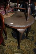 A circular Mahogany Table standing on cabriole legs terminating in ball and claw feet,