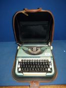 An Imperial portable typewriter in brown case.