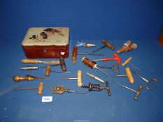 A lacquered box containing Corkscrews.