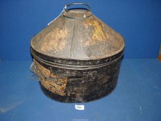 A domed metal hat Box with label fragments, 17" wide x 13" high.