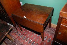 A highly collectable Mahogany Pembroke Table of diminutive size standing on tapering square legs