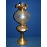A Brass paraffin Lamp with, frosted lamp shade with fluted top, 22" high.