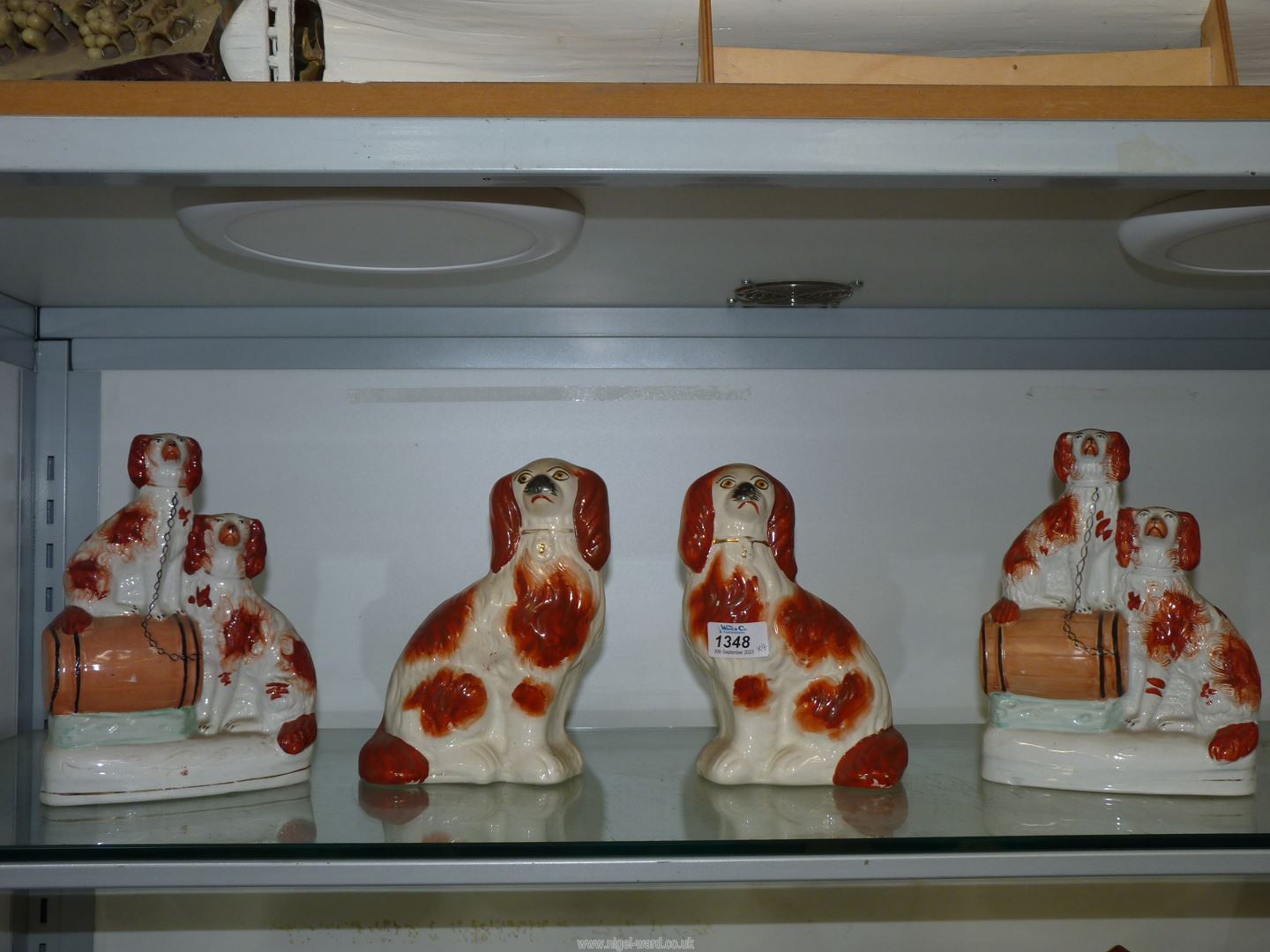 Two pairs of brown and white mantle spaniels;