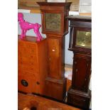 An imposing Oak Long-case Clock having an 8-day movement with a brass face with cast brass