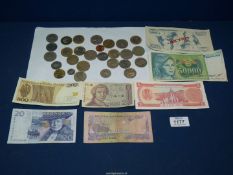 A quantity of foreign notes and coins including; Polish, Portuguese, Foriut, etc.