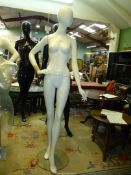A white full body shop mannequin (finger broken), 73" tall. N.B.