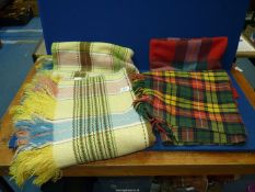 A double 'Weltex' blanket in plaid green, blue and yellow and two Tartan wool travel rugs.