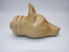 A salt glaze flask in the form of a Fox head, no stopper present, some chips to the ears,