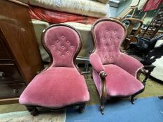 A pair of lady and gent's Victorian Mahogany spoonback Chairs with pink upholstery.