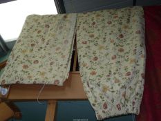 A pair of floral, thermal lined curtains, 72" wide x 56" drop, some fading and rust marks.