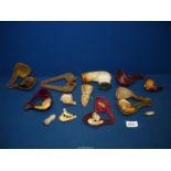 A quantity of antique carved Meerschaum pipe and cheroot heads,