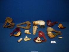 A quantity of antique carved Meerschaum pipe and cheroot heads,