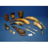 A small quantity of animal horns including one made into a hunting horn, three horn beakers,