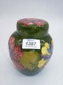 A Moorcroft ginger jar in Hibiscus pattern.