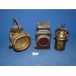 Three old lamps including one by Wolf Safety Lamp Co., Sheffield, rear lamp, etc.