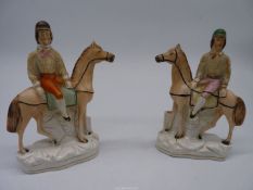 A pair of Staffordshire flatbacks of jockeys on their horses, 7 1/2'' tall.