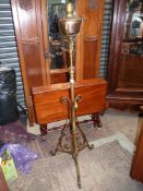 An Arts & Crafts Telescopic oil lamp, circa 1910, constructed of solid brass, 5' high to lamp,