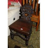 A solid seated Mahogany Hall Chair having turned front legs and an "H" stretcher and front arched