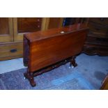 A circa 1900 Satinwood Sutherland Table standing on turned supports,
