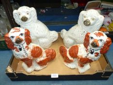 Two pairs of fireside Spaniels; one white and gilt, the other red and white with black detail.