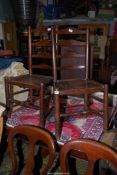 A matched pair of solid Elms seated Clissett Chairs having turned legs and side supports to the