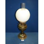 A Brass oil lamp with chimney and white glass shade (some chips), 20 1/4" tall.
