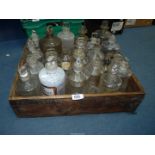 A large collection of Pharmacy/ apothecary Bottles in a Norwegian Brislings box.