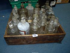 A large collection of Pharmacy/ apothecary Bottles in a Norwegian Brislings box.