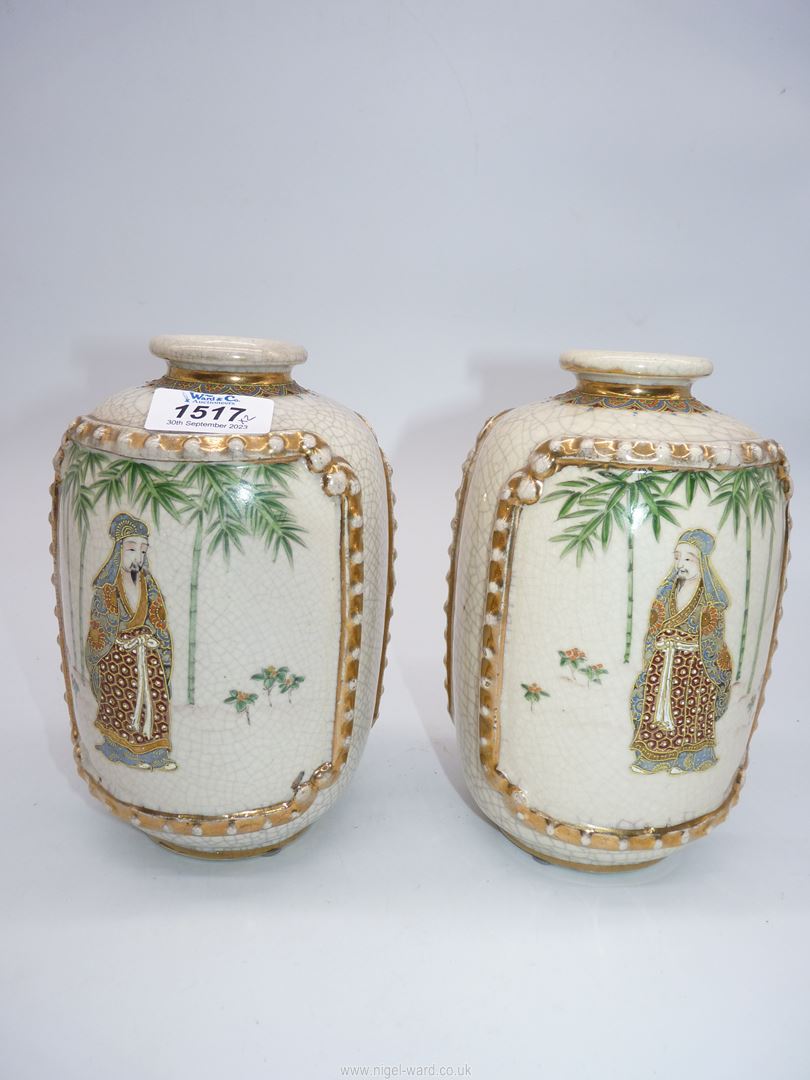 A pair of Satsuma vases from the Meiji period; figures with bamboo,