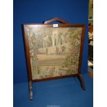 A Firescreen with inset tapestry of a classical garden scene, 21'' wide x 26 1/2'' high.