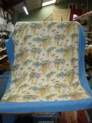 A single Quilt, with blue border and floral centre, 58" x 67".