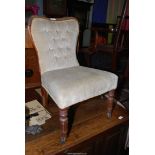 A Rosewood and other woods low/nursing Chair having turned and fluted front legs and button-back