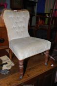 A Rosewood and other woods low/nursing Chair having turned and fluted front legs and button-back