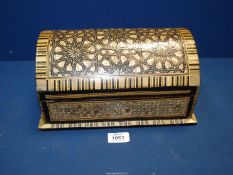 A large 20th Century dome topped casket inlaid with Mother of Pearl detail and having red felt