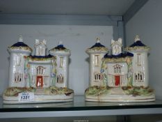 A pair of Staffordshire flatback houses having turrets with blue roofs, some crazing, one a/f.